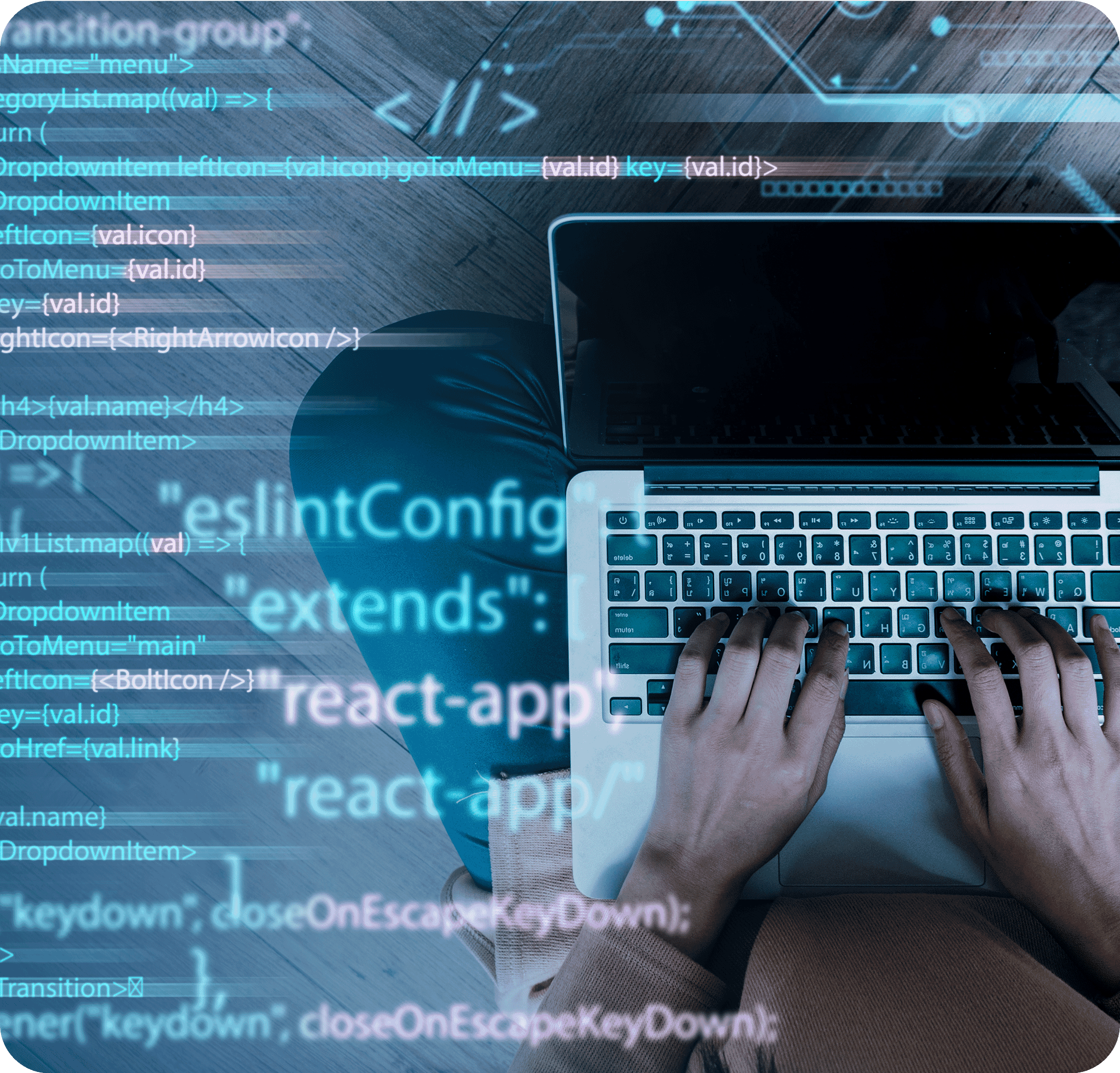 Hands typing on a laptop